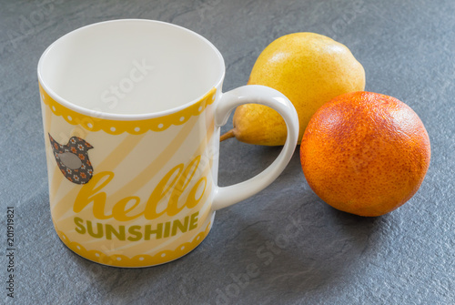 Morning still life scene hello sunshine cup two bright fruits ready for breakfast