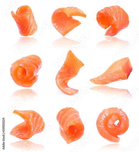 Set of juicy slices of salmon isolated on white background