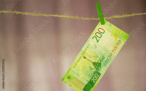 The new currency is two hundred rubles, hanging on a rope photo