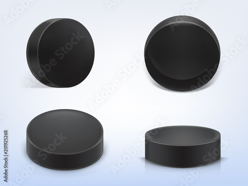 Vector set of 3d realistic black rubber pucks for play ice hockey isolated on light background. Sport equipment, hard round disk, inventory for winter team game on skating rink
