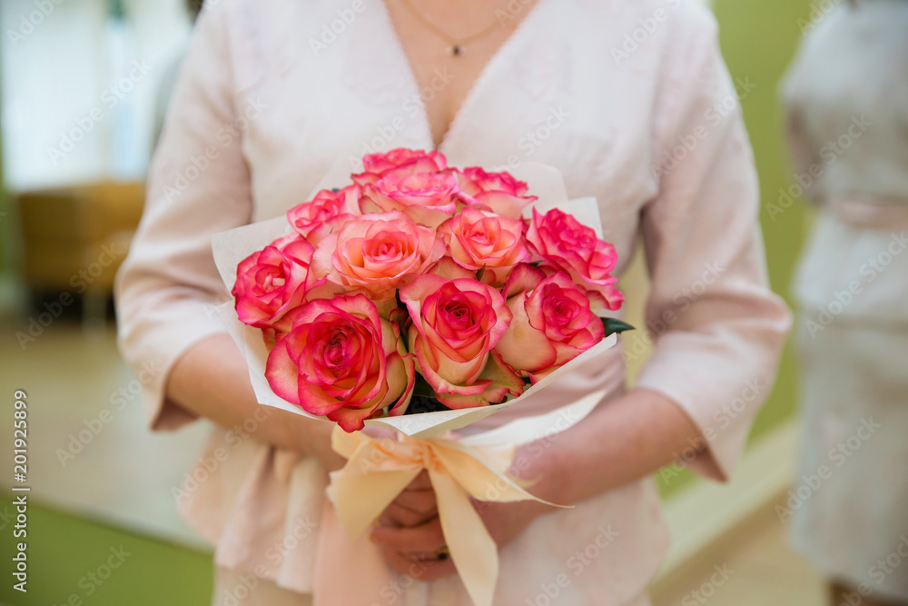 Beautiful wedding bouquet of flowers in bride’s hands Beautiful wedding bouquet of flowers in bride’s hands