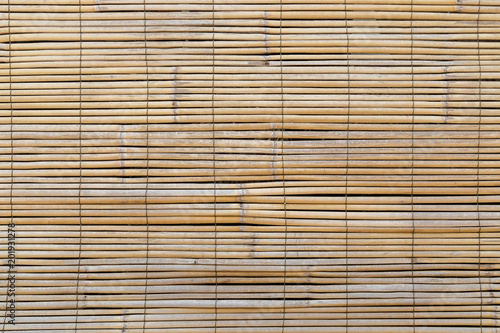 Full frame background of aged wooden bamboo blinds, popular in Asia.