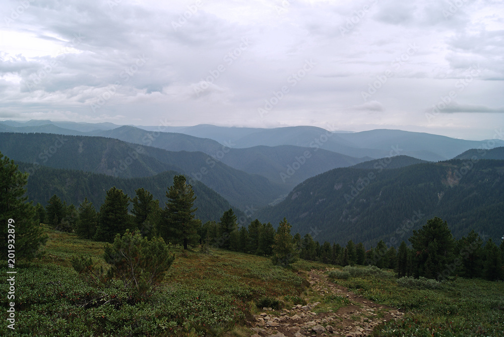 mountain path on the slope of the Baikal ridge in cloudy weather