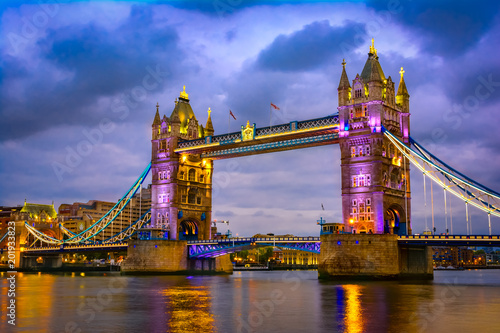 London, The United Kingdom of Great Britain: Night view of the Bridge Tower after sunset. A combined bascule and suspension bridge which crosses the River Thames and has become an iconic symbol of