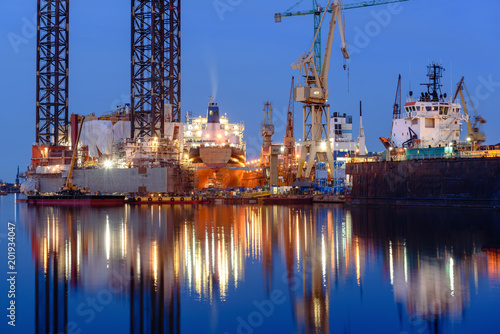 Oil rig docked in shipyard of Gdansk at night. Poland