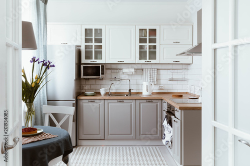 Scandinavian interior design. White grey kitchen room organization