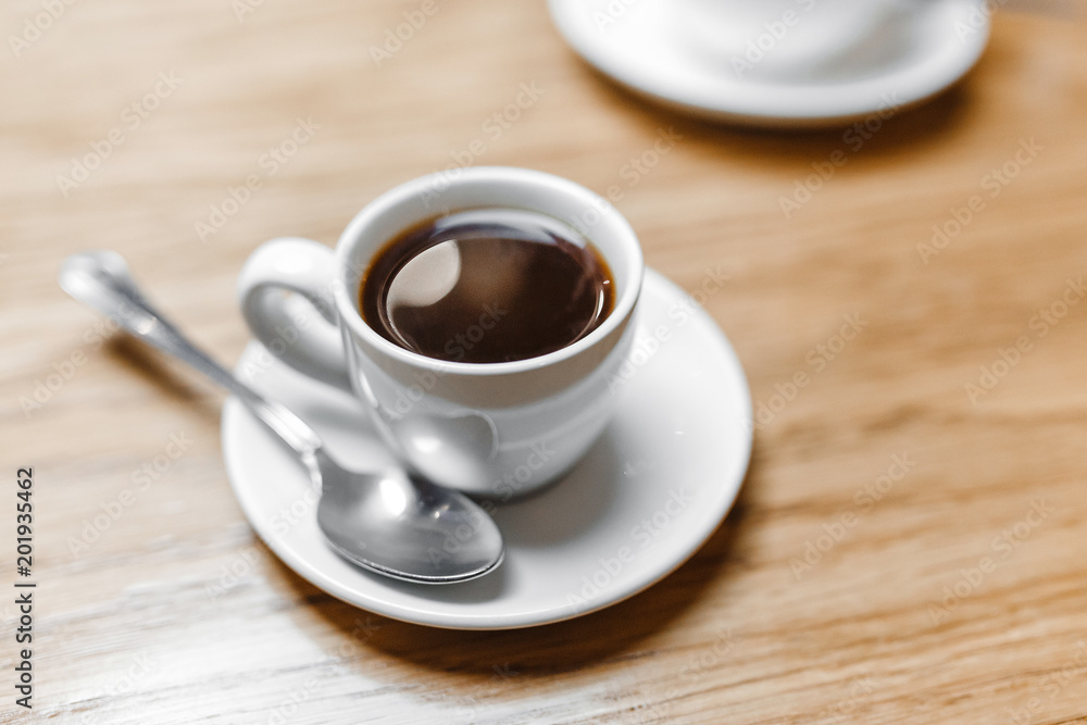 Cup of hot aroma Espresso coffee on the table in cafe Cup of hot aroma Espresso coffee on the table in cafe