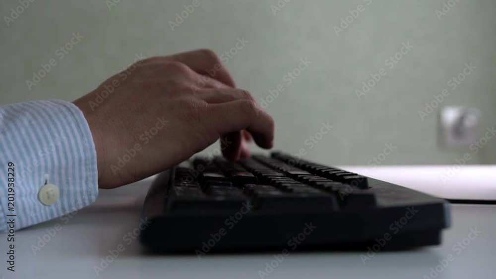 Business Concept Of An Employee And An Office. Hands Of An Unidentified Man In Formal Clothes Typing Text On Computer Keyboard In The Office Business Concept Of An Employee And An Office. Hands Of An Unidentified Man In Formal Clothes Typing Text On Computer Keyboard In The Office