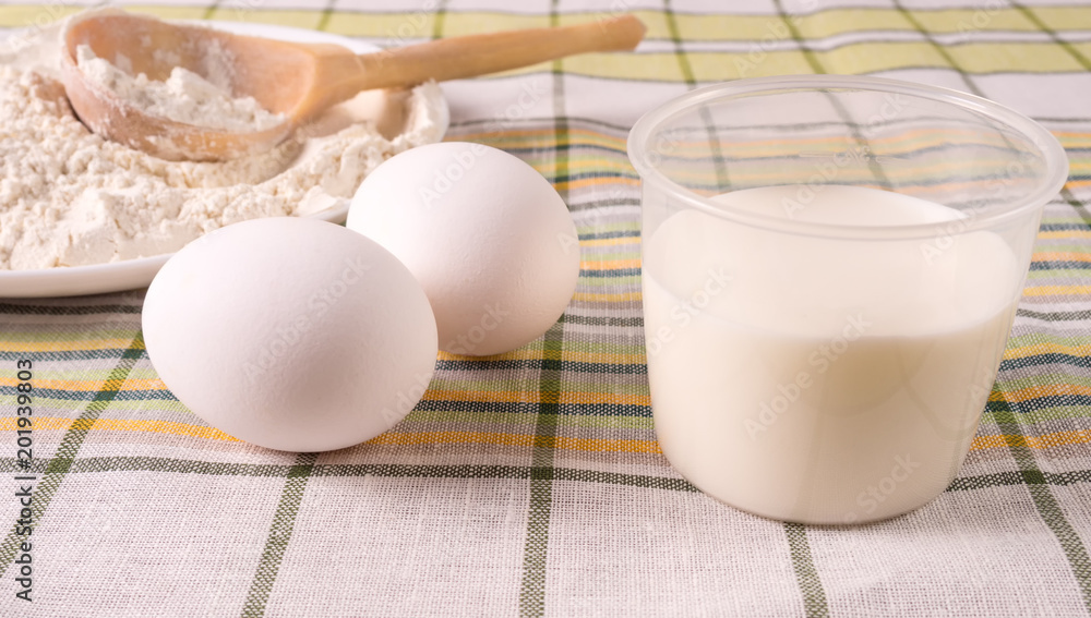 Milk, eggs and flour on the table Milk, eggs and flour on the table
