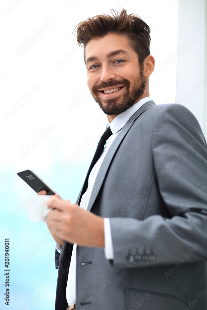 Stylish man in suit is reading information on phone Stylish man in suit is reading information on phone