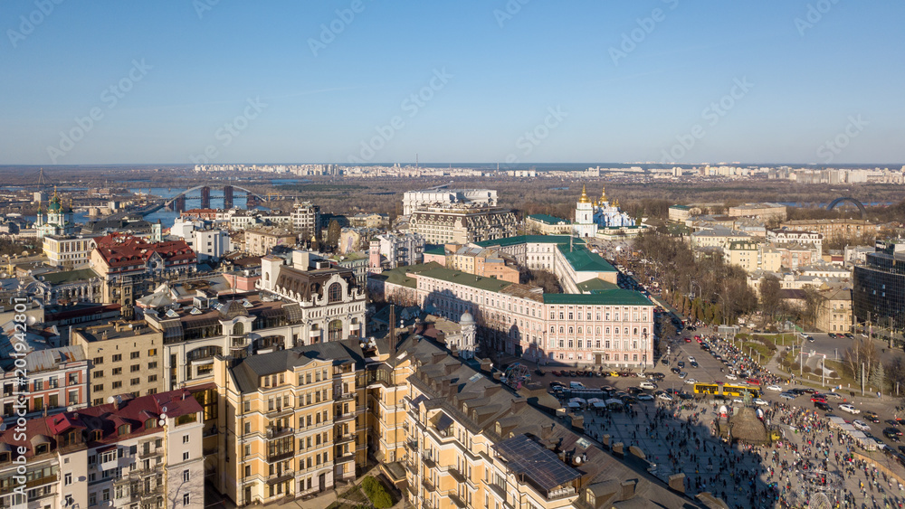 view on the modern buildings in the city center, St. Andrew's Church, Podolsky Bridge and the left coast of the city Kiev, Ukraine