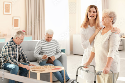 Senior woman with walkers a...
