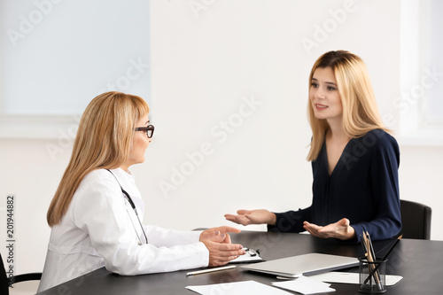 Female doctor consulting yo...
