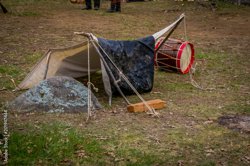 Фотография Outdoor view of campament construction during Civil War representation Reenactme