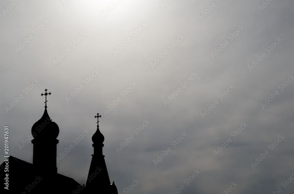 Profile of the two domes of the church with Christian crosses against the background of sky skies.