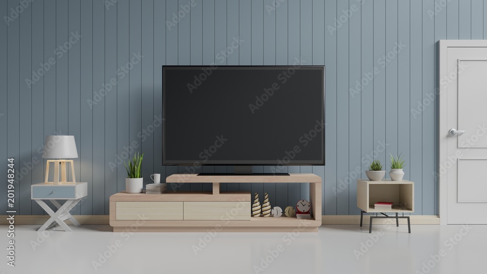 TV on the cabinet in modern living room on blue wall background,3d rendering