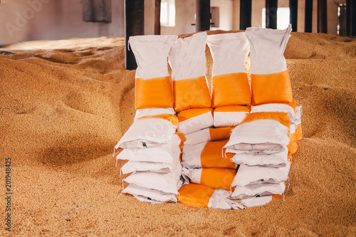 rectangular sacks with finished products stand in the middle of the fertilizer warehouse for the land