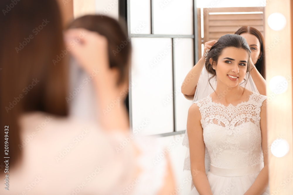 Professional hairdresser working with young bride in salon Professional hairdresser working with young bride in salon
