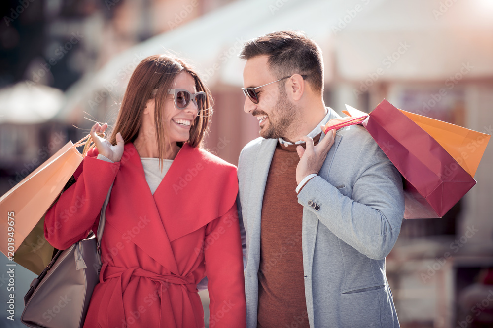 Beautiful young couple enjoying in shopping Beautiful young couple enjoying in shopping
