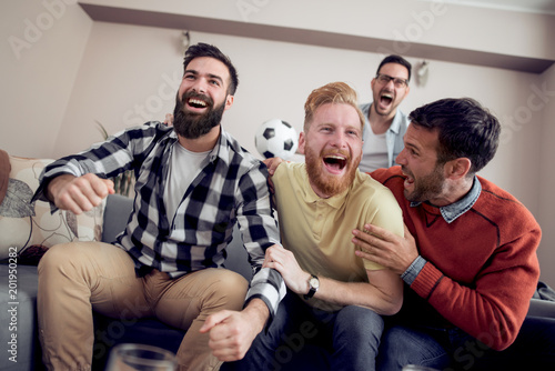 Group of friends watching sport together