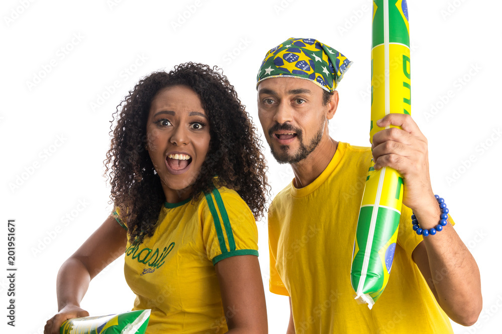 Brazilian couple fans celebrating on soccer match on white background. Brazil colors. Brazilian couple fans celebrating on soccer match on white background. Brazil colors.