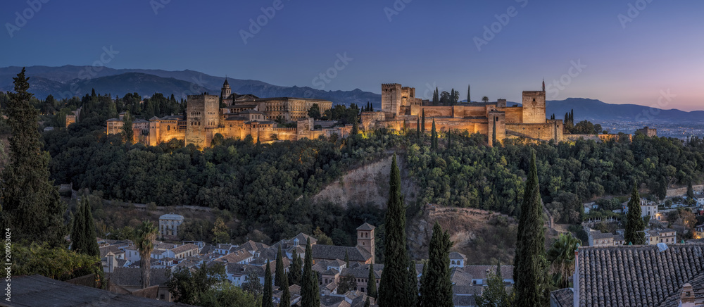 The magnificent Alhambra in Granada at dusk, panoramic image