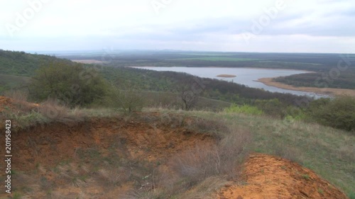 Greengrass landscape, river and couple of trees
