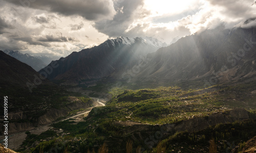 Hunza Valley Landscape, and bright sunlight through cloudy sky © SasinParaksa
