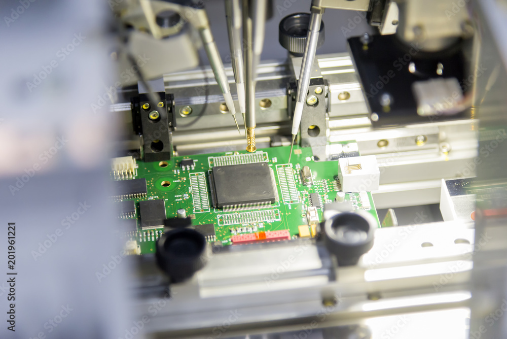 The microchip on the main board in the assembly line in the light blue scene with lighting effect, computer part manufacturing concept. The microchip on the main board in the assembly line in the light blue scene with lighting effect, computer part manufacturing concept.