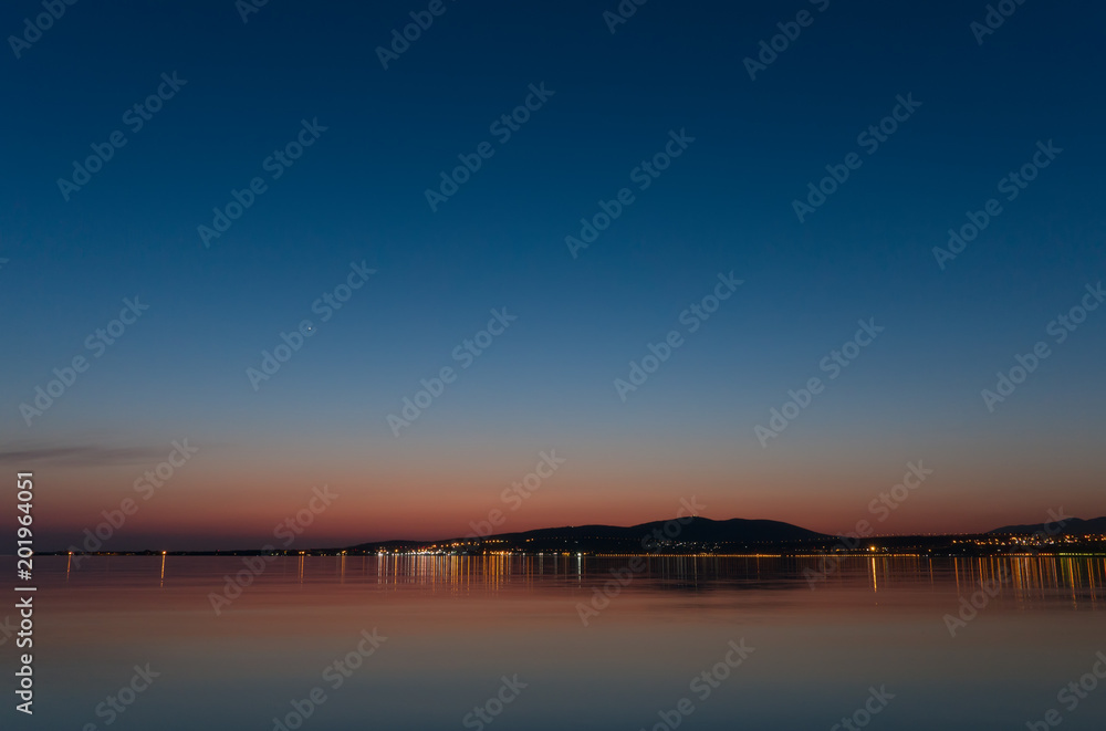 Fototapeta premium Beautiful landscape, mediterranean sea coast and city at night.