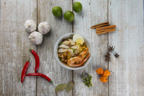 Fototapeta Naklejka Na Ścianę i Meble -  malaysian prawn noodle flat lay with spices
