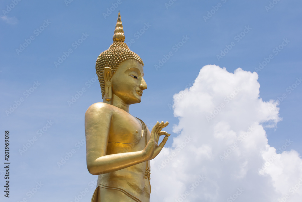 Gold Buddha with blue sky background