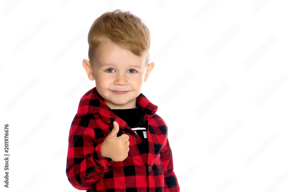 A little boy is holding a finger up. A little boy is holding a finger up.