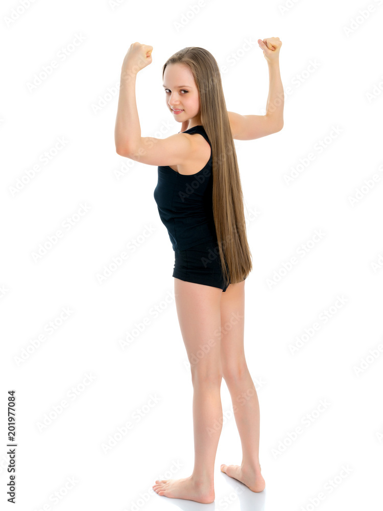 A little girl shows her muscles. A little girl shows her muscles.