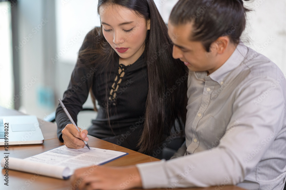 Beautiful secretary helping boss in office at workplace. Beautiful secretary helping boss in office at workplace.