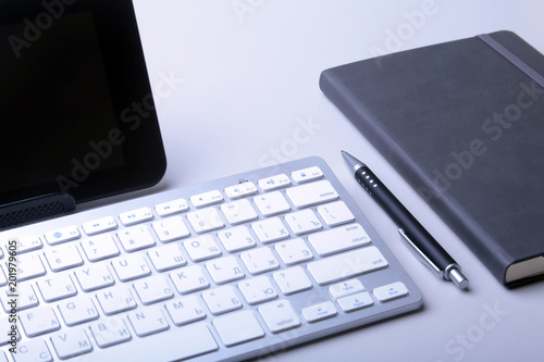 Corporate business desktop with laptop, digital tablet, accessories and work equipment. selective focus.