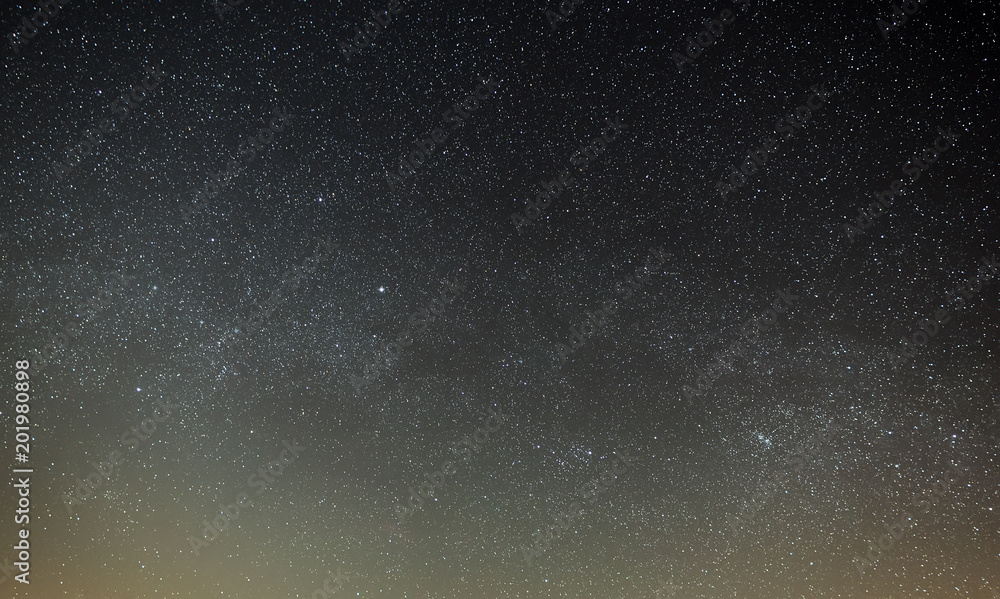Night sky with a bright star of the Milky Way. Panoramic view of the starry space.
