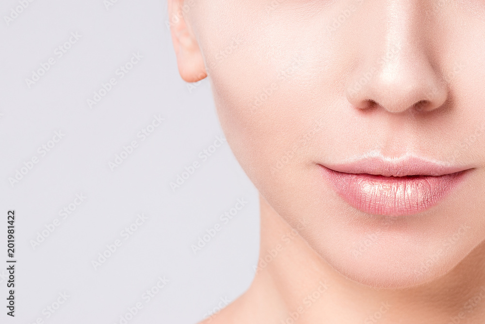 Woman beautiful face portrait on gray background. Beauty Portrait. Beautiful Spa model Girl with Perfect Fresh Clean Skin. Blonde female looking at camera. Youth and Skin Care Concept. Woman beautiful face portrait on gray background. Beauty Portrait. Beautiful Spa model Girl with Perfect Fresh Clean Skin. Blonde female looking at camera. Youth and Skin Care Concept.