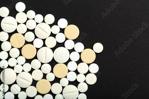 tablets and pills on dark background © fotofabrika