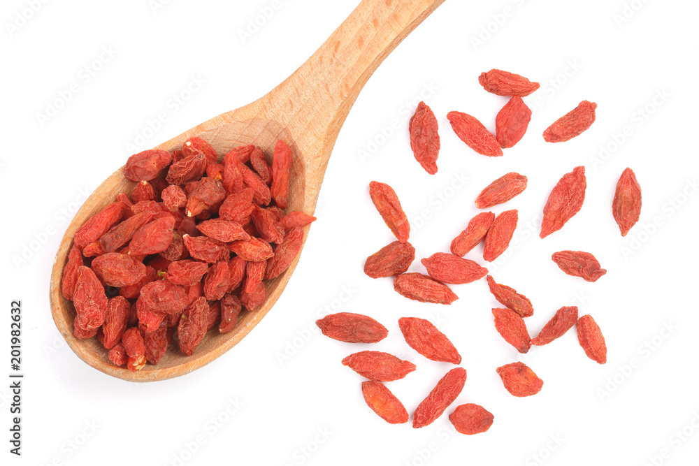 Dried goji berries in wooden spoon isolated on white background Dried goji berries in wooden spoon isolated on white background