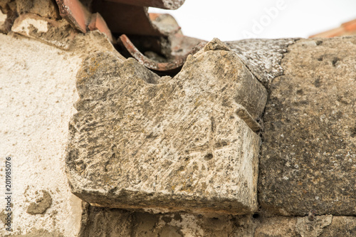 Peleas de Arriba, Spain. Stonemasonry with mason's mark from the ancient former Monastery of Valparaiso used in new houses and walls of the town of Peleas de Arriba photo