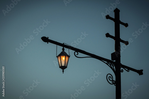 vintage street lantern against a dark sky