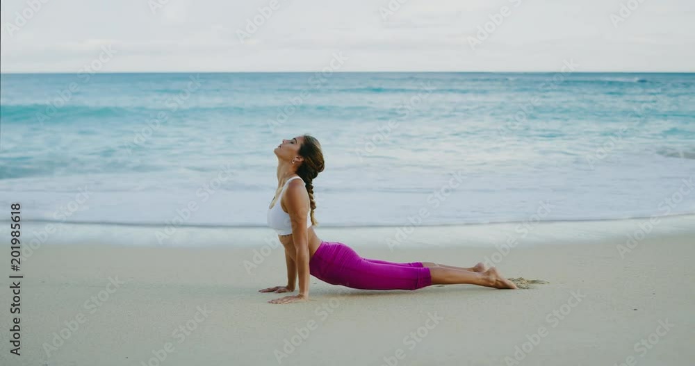 Beautiful young woman practicing yoga at sunrise Beautiful young woman practicing yoga at sunrise