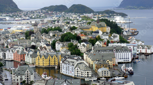 Alesund  Norway - Aerial city view from the top of Aksla mountain  beautiful colorful houses on mountains background