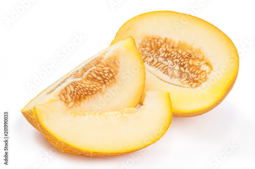 Slices sweet yellow melon with seeds isolated over white background