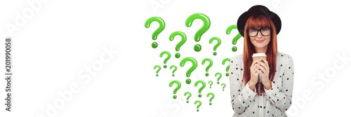 Woman with coffee thinking with green shiny question marks