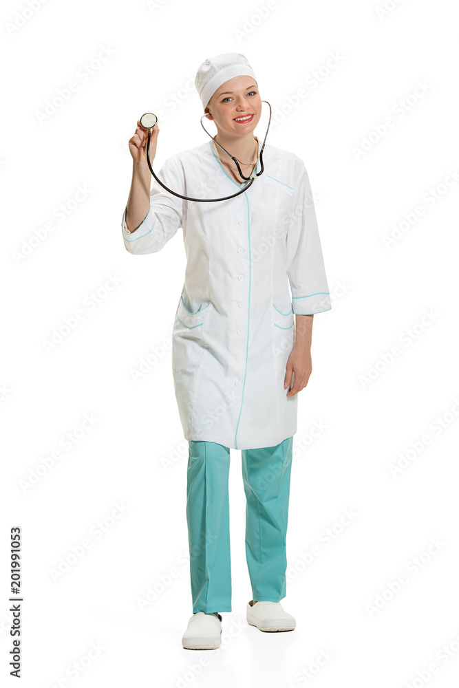 Beautiful young woman in white coat posing at studio. Full length studio shot isolated on white. Beautiful young woman in white coat posing at studio. Full length studio shot isolated on white.
