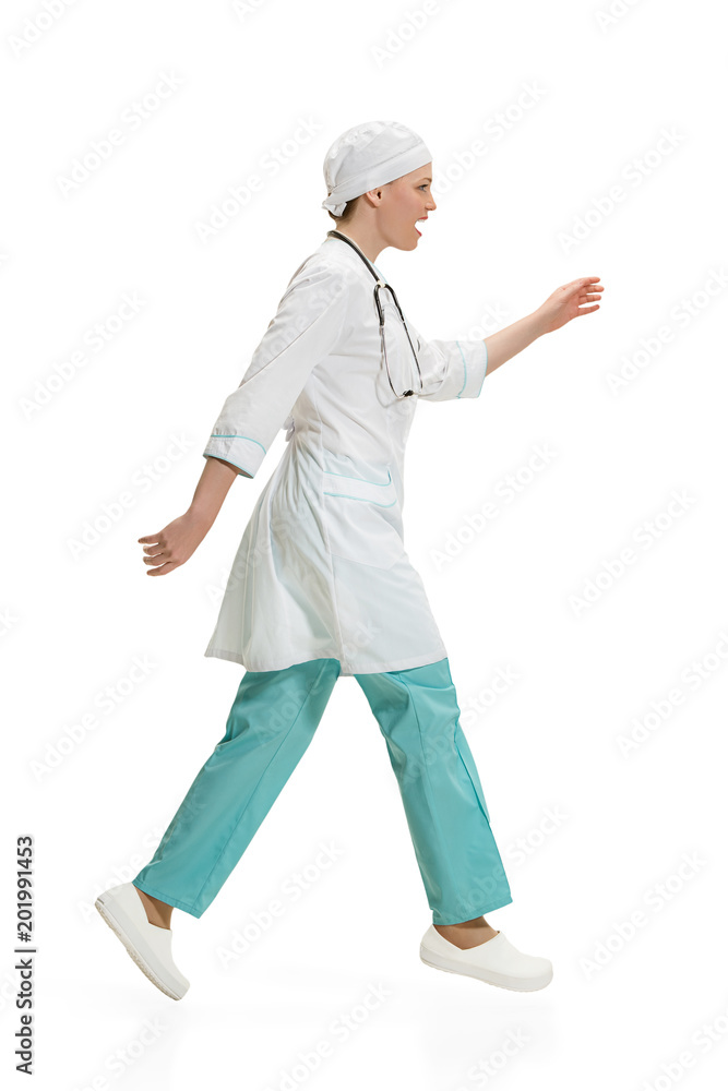Beautiful young woman in white coat posing at studio. Full length studio shot isolated on white. Beautiful young woman in white coat posing at studio. Full length studio shot isolated on white.