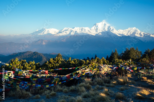 beautiful view of the landscape of the Himalayan mountains. Snow-covered mountain tops and Tibetan multi-colored prayer flags. trekking concept in the mountains