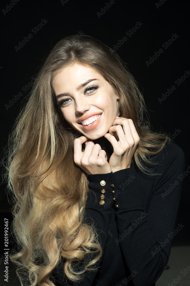 Gorgeous long hair. Fashion woman hair style. Sensual blonde model in black  clothes. Beautiful girl face makeup. Passionate sexy attractive beautiful  blonde girl with healthy long hair, perfect makeup Stock Photo |